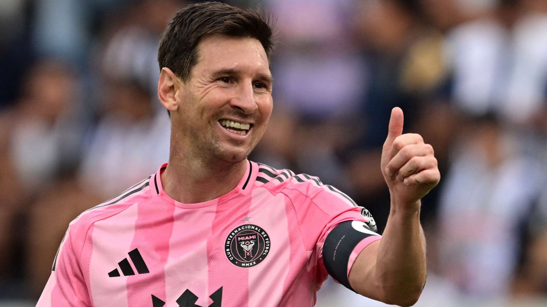 Lionel Messi celebrates with the 2022 World Cup trophy
